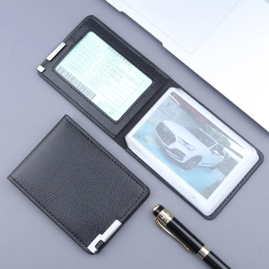 Slim black litchi pattern leather driver's license holder with metal corners and card slots