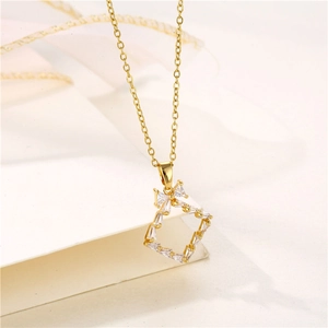 Golden stainless steel necklace with a bow-decorated square pendant and clear gemstones