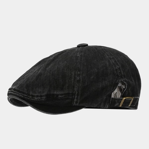 Vintage washed black denim newsboy cap with adjustable metal side buckle and classic panels