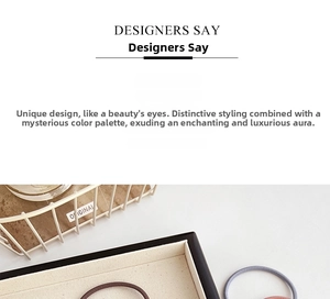 Detail of high-elasticity hair ties in neutral brown and pink tones on a minimal tray
