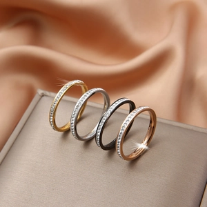 Set of four stainless steel eternity rings in gold silver black and rose gold