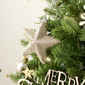Rotating musical Christmas tree set with gold glitter star topper on desktop decoration