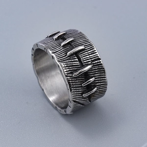 Industrial punk style wide silver ring with stitched relief and vintage metal finish