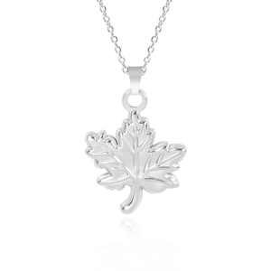 Detailed macro view of silver stainless steel maple leaf pendant with fine vein texture