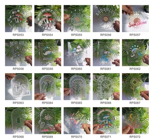 Grid display of 20 rainbow prism window clings with mushroom and butterfly holographic designs