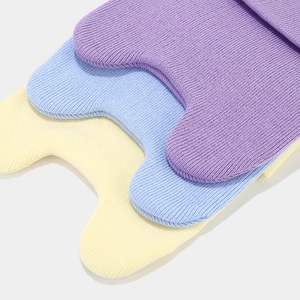 Soft knitted baby knee pads in purple, light blue and yellow with fine ribbed texture