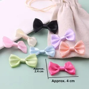 Detailed view of colorful 4cm handmade satin ribbon bows for DIY doll accessories