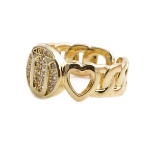 Macro shot of gold heart ring with chain band and pave-set white cubic zirconia stones