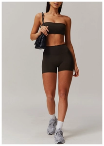 Detail of dark brown matte high-stretch yoga set with high waist shorts and sports bra