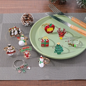 Christmas napkin rings set with colorful enamel Santa, Snowman and Penguin designs