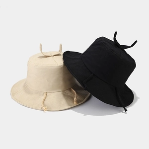 Cute sprout bucket hats in beige and black with drawstring details for summer sun protection