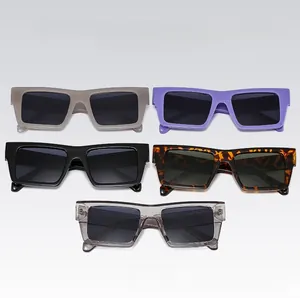 Flat lay of five retro rectangular sunglasses in assorted colors including tortoise and grey