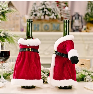 Detail of velvet Christmas wine bottle covers in dress and Santa coat styles