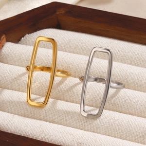 Minimalist 18K gold and silver plated rectangular open rings on a jewelry box display