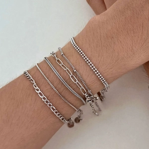 Set of five silver minimalist stainless steel bracelets including snake and bead chain styles