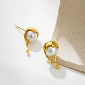 18K gold fluid metal earrings with white pearls in a minimalist modern design