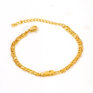 Double-layered gold anklet with Figaro and snake chains featuring a cloud pendant