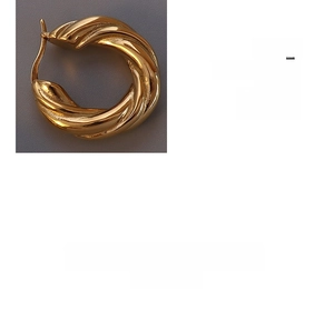 Close-up of chunky gold-plated twisted hoop earring with a bold spiral design texture