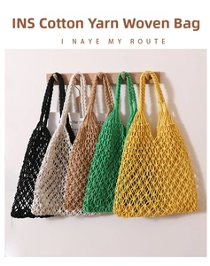 Detail of colorful cotton cord mesh bags showing hollow diamond weave and long handles