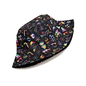 Detail of black reversible bucket hat with colorful Merry Christmas and New Year prints