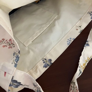 Interior view of floral canvas tote bag featuring a functional small inner pocket