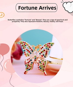 Detail of creative butterfly keychain with colorful rhinestones and gold metal finish