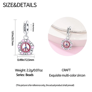 Detail view of silver angel olive charm bead with colorful zircons and size specifications