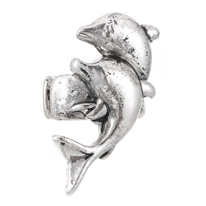 Close-up of vintage silver dolphin ring with detailed 3D texture on white background