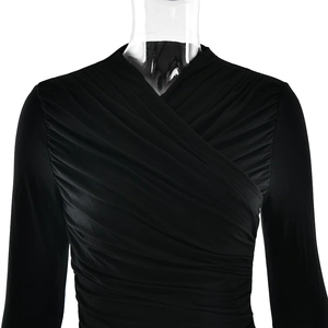 Detail shot of the black V-neck top showing the ruched design and crossed fabric texture