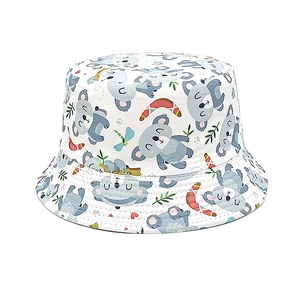 Detail of white cotton bucket hat featuring Australian cartoon koala and leaf patterns