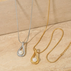 Minimalist teardrop pearl pendant necklace in gold and silver finish with fine snake chain