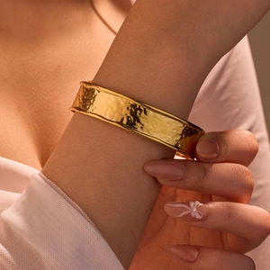 Polished gold hammered texture wide open cuff bracelet for women on wrist