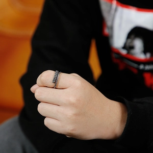 Close-up of vintage silver octopus tentacle ring with detailed suckers on thumb
