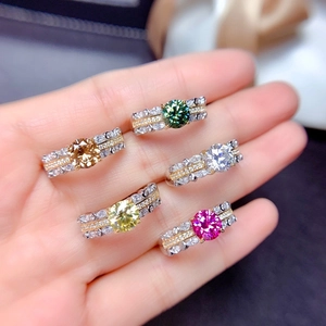 Set of five vibrant cushion cut rings in silver and gold tones with pave accents