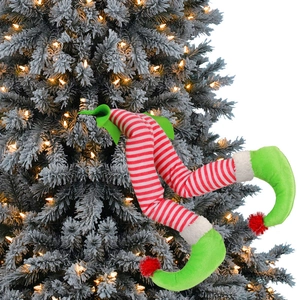 Christmas elf legs decor with red white stripes and green shoes on festive tree