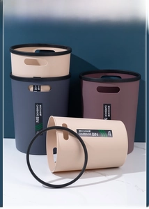Macro shot of plastic garbage bins with handles and removable black press rings