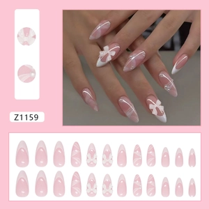 Pink French long almond press-on nails with 3D white bow and pearl embellishments