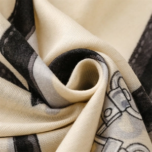 Macro shot of soft cotton-linen fabric with black and gray abstract chain patterns