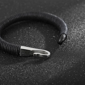 Braided black leather bracelet featuring a silver stainless steel fishhook clasp buckle