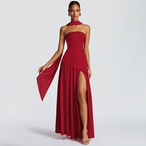 Detail of red tube top maxi dress with high slit and matching decorative scarf