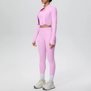 Three-piece pink yoga set with zip jacket, sports bra, and high-waist leggings