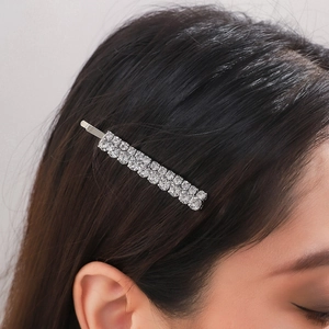 Sparkling crystal rhinestone bobby pin hair clip worn by a model in a close-up side view