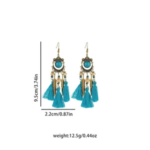 Detail shot of bohemian tassel earrings in blue and bronze with precise size dimensions