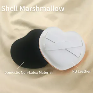 Extra large heart-shaped marshmallow powder puffs in black and white on silk