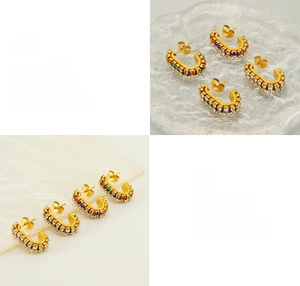 Detail of C-shaped stainless steel earrings with sparkling rows of colorful zircon stones
