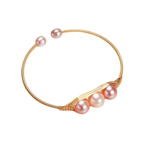 Elegant gold pea-pod open bracelet featuring five delicate light pink freshwater pearls