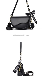 Detail of black leather saddle bag showing CLASSIC embossing and stylish bow scarf detail
