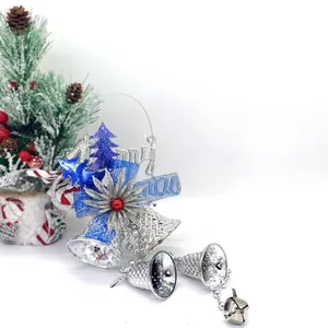Blue and silver Christmas bell ornaments with Merry Christmas banner and decorative tree