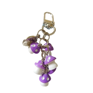 Handmade purple resin mushroom keychain with silver lobster clasp and decorative metal plate