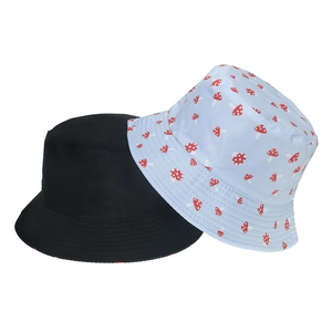Unisex cotton bucket hats in solid black and blue mushroom print for summer sun protection